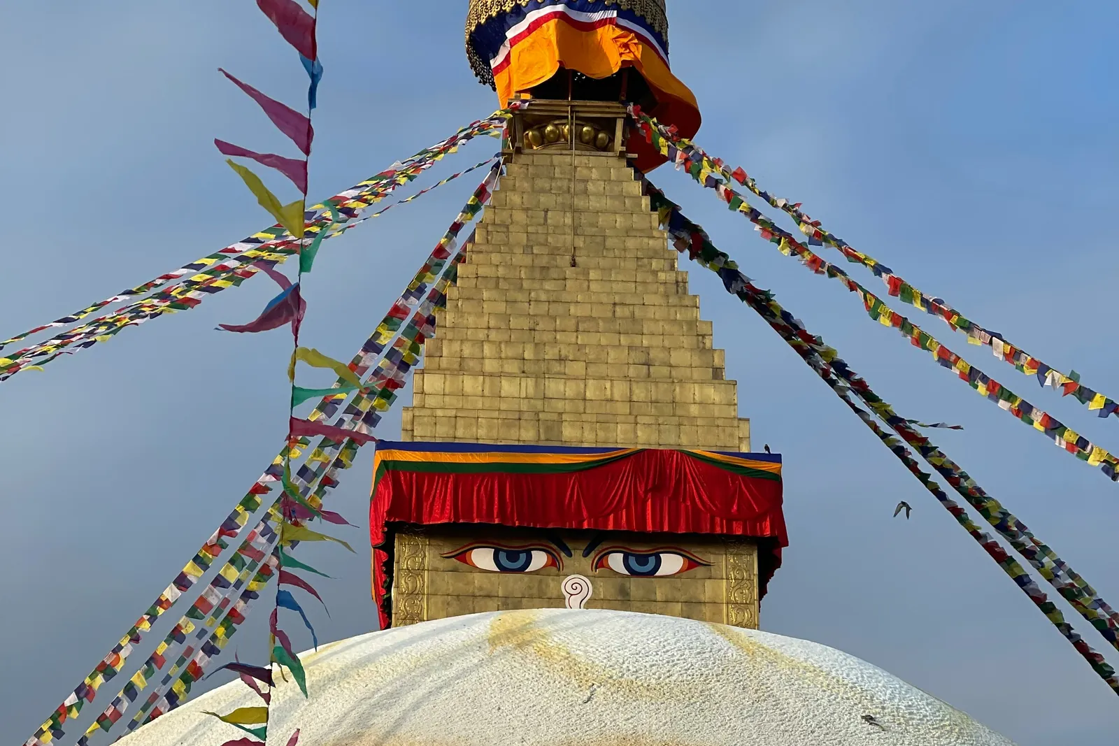 Boudhanath Stupa and prayer flags in Kathmandu (Photo: LEASANG SHERPA / Unsplash)